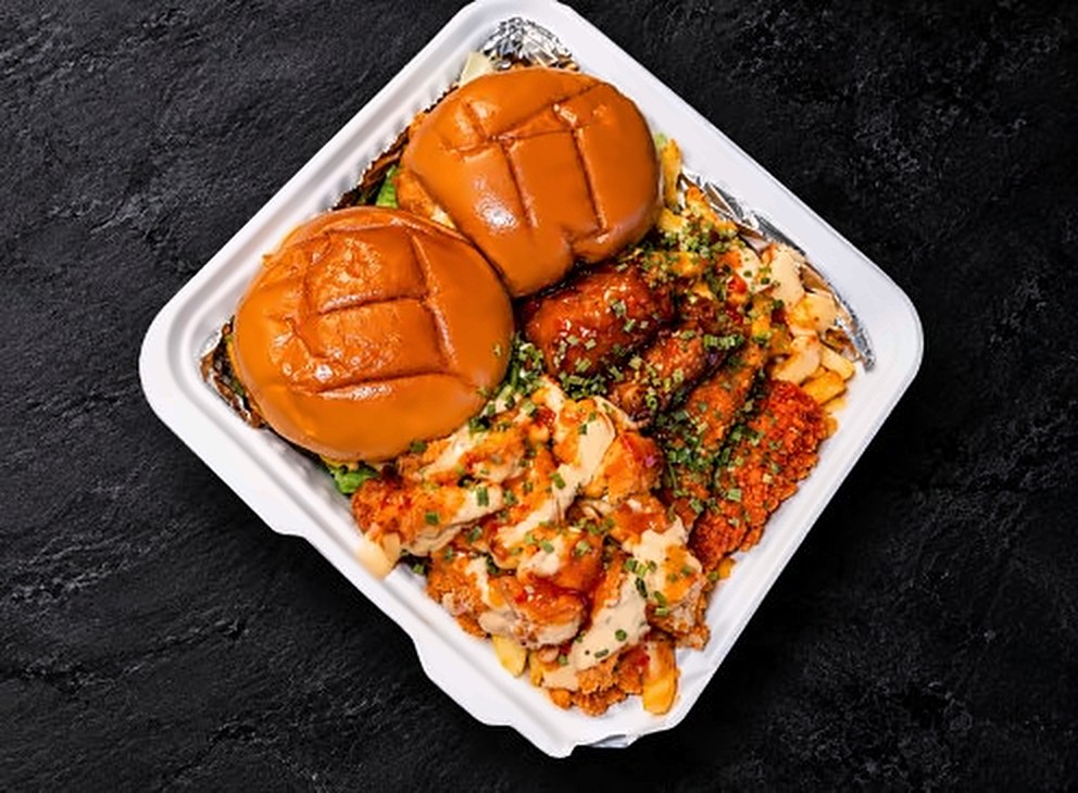 The Munch Box for 2: two Soul Burgers with wings, strips, fries and mac and cheese